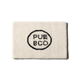 TUFTED MAT / PUEBCO LOGO